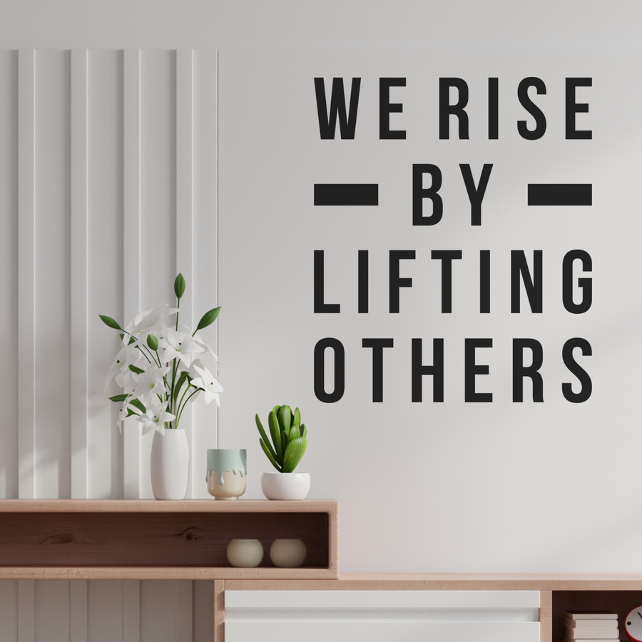 Motivational wall decal featuring inspirational wall quotes and stickers for we-rise-by-lifting-others. 