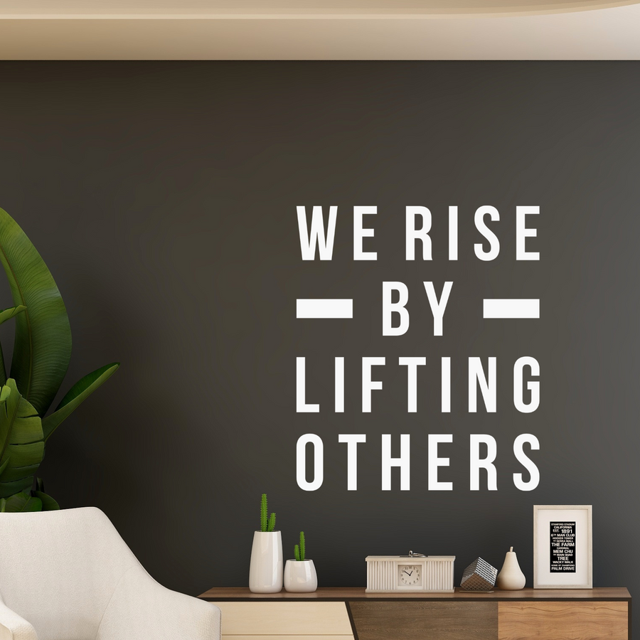 Motivational wall decal featuring inspirational wall quotes and stickers for we-rise-by-lifting-others. 