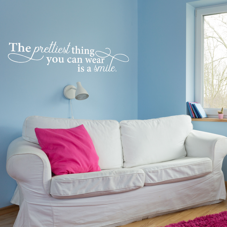 Motivational wall decal featuring inspirational wall quotes and stickers for the-prettiest-thing-you-can-wear-is-a-smile. 